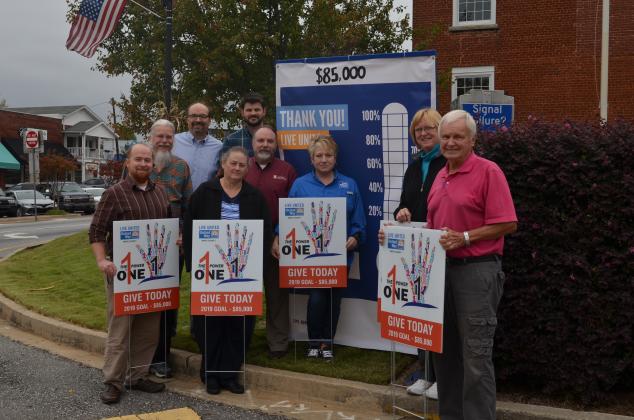 Shown from left at the Oct. 25 unveiling of a fundraising “thermometer” sign in downtown Cleveland are United Way of White County representatives Wayne Hardy, Paul Scott Abbot, Carl Free, Beth Kastner, Nathan Eason, Donald Harris, Denise Loggins, Carol Powel and Gene White. (Photo/Susan Egan)