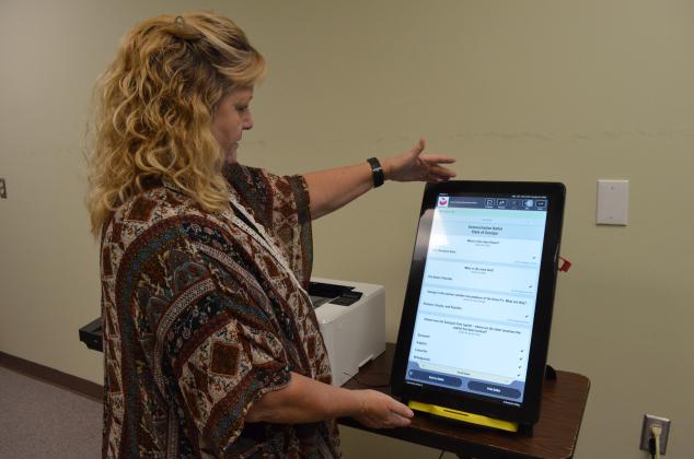 White County Chief Voter Registrar Lisa Manning explains the touch screen interface of new voting machines that will be used in 2020 elections. Georgia recently switched to a system that will produce a paper copy of voter choices in conjunction with the digital vote count. (Photo/Stephanie Hill)