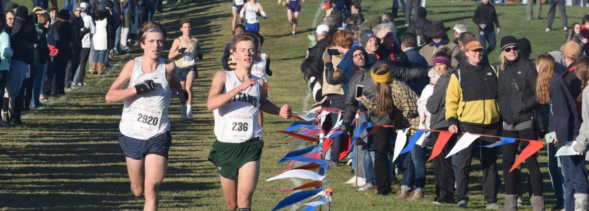 Eamonn O'Bryant, left, and Blessed Trinity's Adam Wade sprint toward the finish line during the state chmpionship race in Carrollton. (Photo/Mark Turner)