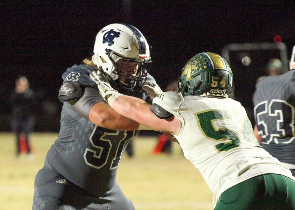 WCHS guard Jacob Anderson, left, locks up with Blessed Trinity defensive lineman Regan Smith during the season finale. (Photos/Staci Sulhoff)