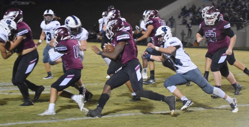 WCHS linebacker Jesse Moose, right, runs down Chestatee quarterback Christian Charles during the first half of the region game last Friday night in Gainesville. (Photos/Mark Turner)