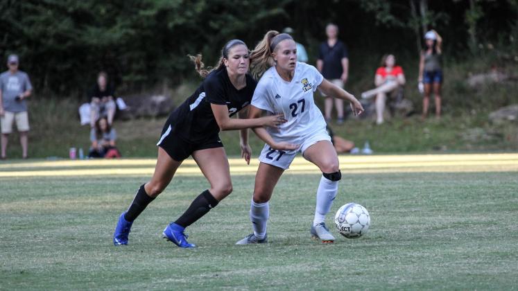 Jennifer McCall, right, scored the game-winning goal in the second overtime period to give the Bears their first AAC tournament title. (Photo/TMU Athletics)