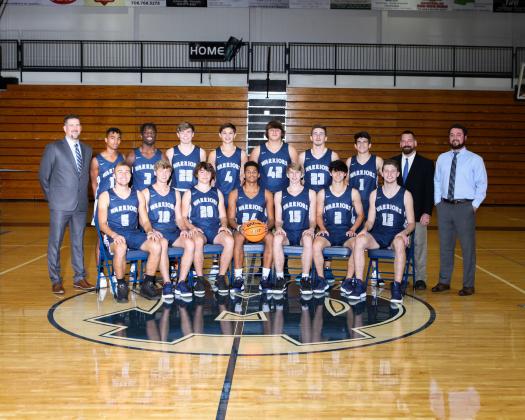Members of the White County Warriors basketball team are, front from left, Reece Dockery, Rylee Higgins, Alex Thornton, Will Sampson, Marty James, Dylan Sargent, and Jimmy King; back row, head coach Wade Mawdesley, Darius Cannon, Silas Mulligan, Kenny Simpson, Jadon Yeh, JD Trowell, Cooper Turner, Riley Egerton, assistant coach Robbie Bailey, and assistant coach Chris Black. (Photo/Staci Sulhoff)