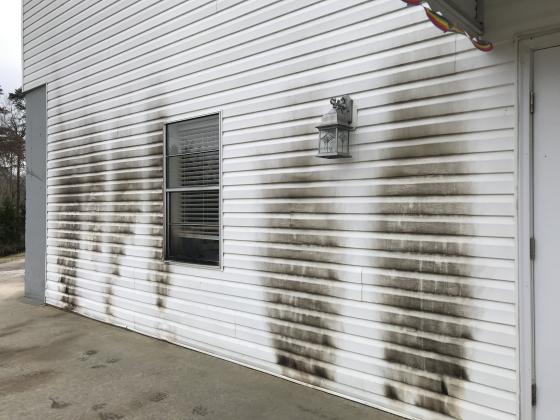The backside of Solid Rock Baptist Church was damaged after an unidentified man set fire to it. (Photo/Stephanie Hill)