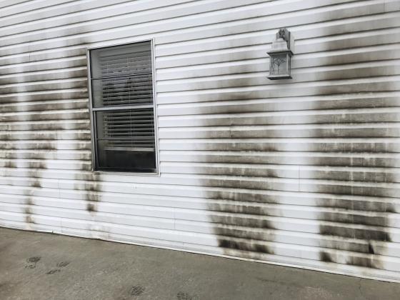 The backside of Solid Rock Baptist Church was damaged after an unidentified man set fire to it. (Photo/Stephanie Hill)