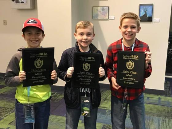 Mossy Creek students Hunter Moyers, Brody Kelley and Zachary Godfrey all proudly hold up their awards from the state competition last week in Savannah. (Submitted photos)