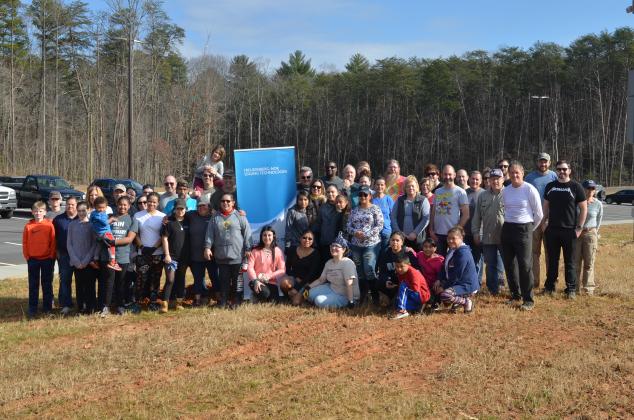 Some of the participants in Saturday’s tree planting are shown gathered for a group photo around lunch. (Photo/Wayne Hardy)