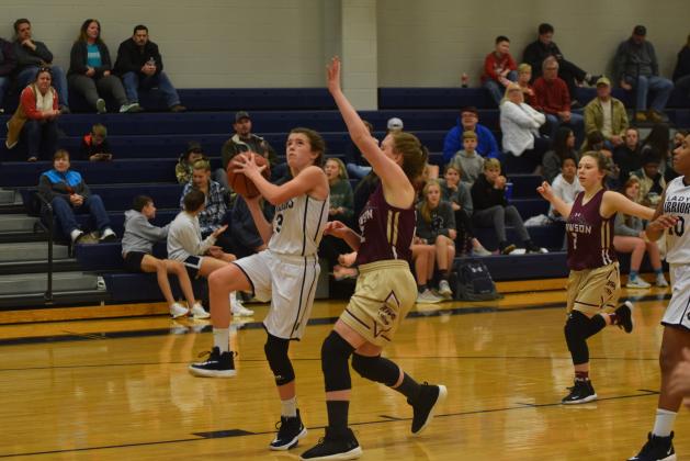 Paisley Cathey goes up for a layup during the WCMS seventh-grade girls win over Dawson County. The Lady Warriors are 7-0 this season. (Photo/Mark Turner)