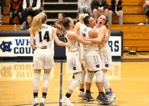 White County basketball players, from left, Rachel Lovell, Dasha Cannon, and Maddie Futch celebrated after closing out a 42-40 win over Chestatee last Friday night in Cleveland. (Photo/Staci Sulhoff)