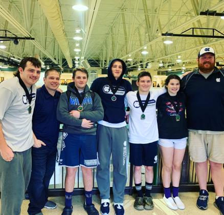 The Warriors had five wrestlers medal at the Burnt Mountain Classic last weekend in Jasper. Shown, from left, are Devin Sullen (285-pound champion), WCHS head coach Patrick Lowendick, Seth Stonecyher (182-pound fifth place), Justin Gilbert (170-pound fourth place), Sean Wurtz (132-pound second place), Sidney Sullens (Girl's 152-pound champion), and assistant coach Nathan Riddle. (Photo/WCHS Wrestling)