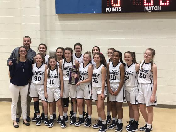 Members of the White County Middle School seventh-grade team are, front from left, head coach Jodie Watkins, Madi Black, Emma Lightsey, Paisley Cathey, Mya Yeh, Jada Palumbo, Kiannah Dorsey, Emily Rhoads, and Sarah Grace Jarrard; back row, coach Kyle Watkins, Emma Kerley, Jenna Pratt, Kylie Watkins, Amelia Kennedy, and Lauren Black. Not shown are managers Brooklyn Thomason and MaKenna Clark. (Photo/WCMS Athletics)