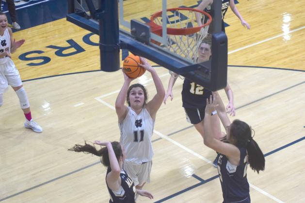 Maddie Futch puts up a shot from close range during the first quarter of the Regon 7-AAAA matchup Tuesday night in Cleveland. (Photo/Mark Turner)