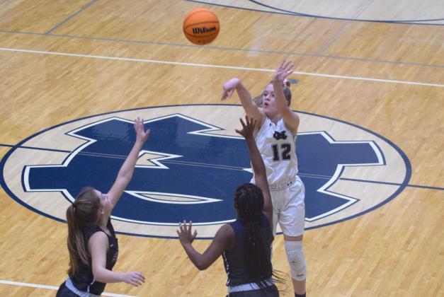 Bentley Cronic knocks down a long 3-point shot during the region tournament win over West Hall Tuesday night in Cleveland. (Photo/Mark Turner)