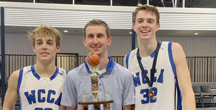 White Creek's Jim Fuller, left, head coach Preston Bowen, and Cameron Hay show off the tournament hardware after winning the Knight's Court Classic. (Photo/WCCA)