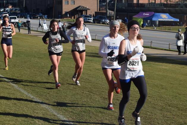 Paced by Sydnee Nix, left, and Ellie Gearing, the Lady Warriors posted a fifth-place finish at the Class AAAA state cross country meet last fall, the highest state finish for a WCHS this year. (Photo/Mark Turner)