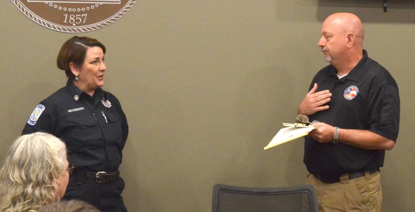 The retiring Ana Newberry listens as White County Public Safety Director David Murphy praises her 17 years of service. (Photo/Wayne Hardy)