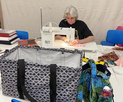 Jan Carlson works on mask kits at Quilt’n Kaboodle in Cleveland. (Photo courtesy Robbie Welch)