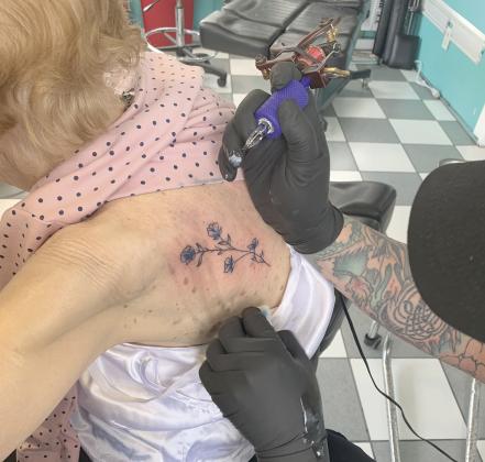 Bythewood chose forget-me-not flowers for her tattoo. (Top photo courtesy Ashlyn Turner)