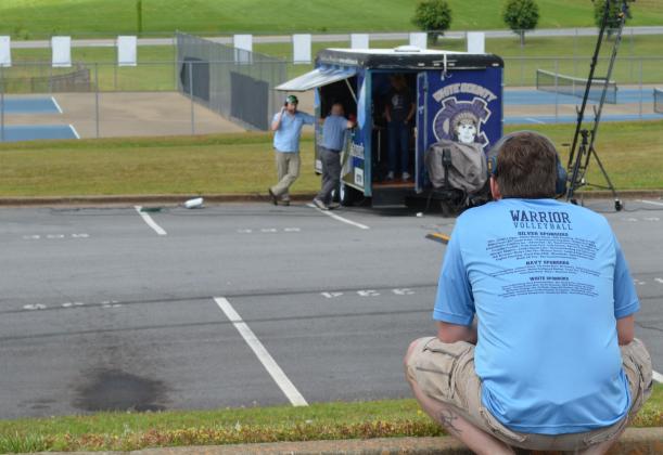 White County High School Assistant Principal Adam Wiley looks at a video production truck in the school parking lot where a “drive-in” graduation ceremony will be held this Friday due to restrictions related to the COVID-19 pandemic. The event will also feature a screen for video and a live broadcast. (Photo/Stephanie Hill)