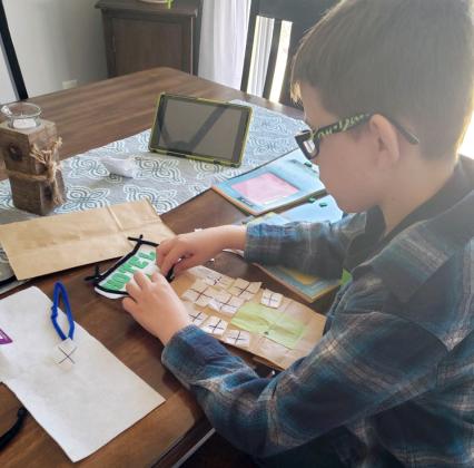 Jerome Kukurugya is working on one of the STEM activities that was part of the #BuildWithBreaux STEM Challenge. (Submitted photos)
