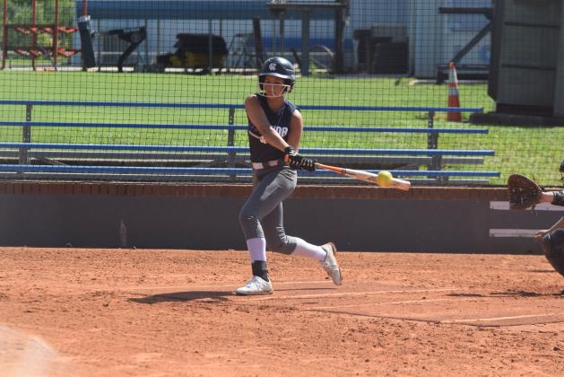 Caitlyn Gailey slaps at a pitch during an intra-squad scrimmage last week at the WCHS softball complex. (Photo/Mark Turner)