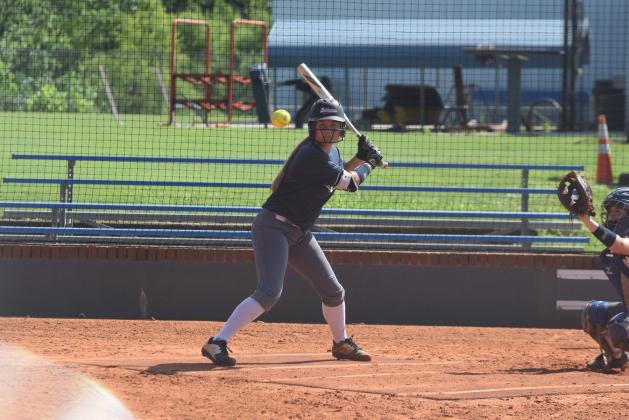 Lianna O'Kelly, left, and the WCHS softball team take on Habersham Central Tuesday in a preseason scrimmage. (Photos/Mark Turner and Staci Sulhoff)