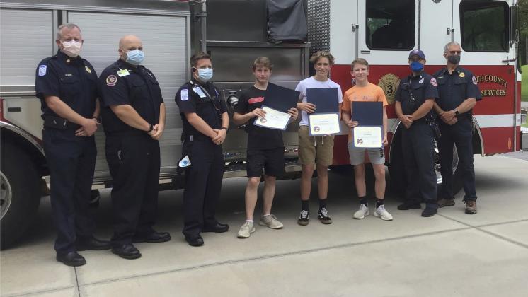Fire services photo: Pictured, from left, are Fire Chief Seth Weaver, Paramedic Josh Eaten, EMT  Matt Hill, Jack Bandy, Daniel Green, Ben Bandy, Captain Josh Taylor, and Battalion Chief John Lumsden. (Submitted photo)