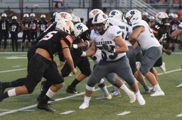 Tackle Devin Sullens, right, and the WCHS offensive line paved the way for 468 total yards with five rushing touchdowns and two more touchdows through the air. (Photo/Mark Turner)
