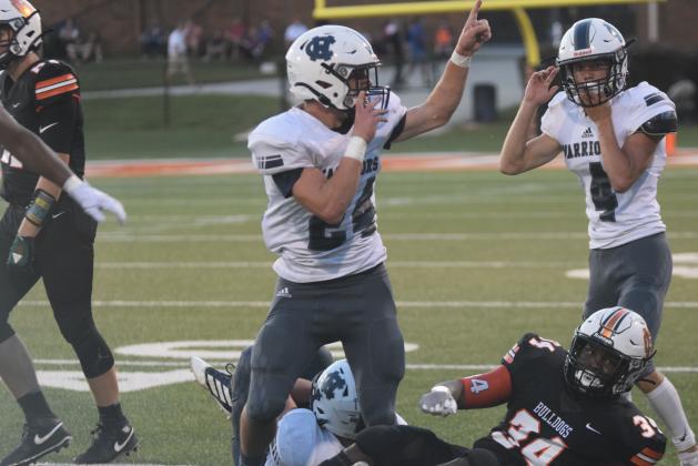 Jesse Moose, left, and Reece Dockery celebrate after Moose comes up with a fumble recovery in the second quarter of the win over Hart County. (Photo/Mark Turner)