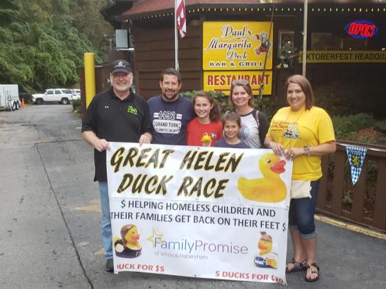 Shown at the first place presentation, from left, are Paul’s Margarita Deck and event sponsor Ron “RT” Turner, winners Barry and Cindy Jordan with their children, and FPWH Director Martie Brooks. (Submitted photos)