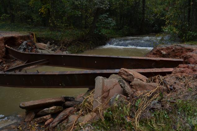 Heavy rains closed roads and wiped out some small bridges, such as this one on Airport Road. (Photo/Wayne Hardy)