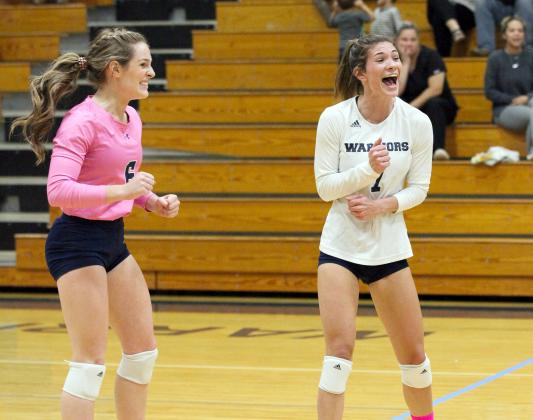 Macy Boggs, left, and Shelby Spain celebrate during the team's win over Habersham Central. (Photo/Staci Sulhoff)