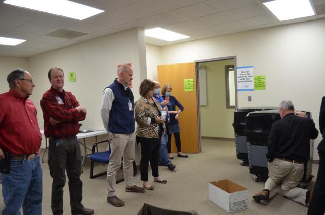 Election Superintendent Garrison Baker shows the newly formed White County Board of Elections how to retrieve the paper ballots from the machines at the voter registrar office. He also explained the process of what to do with the ballots after they are collected. (Photo/Stephanie Hill)