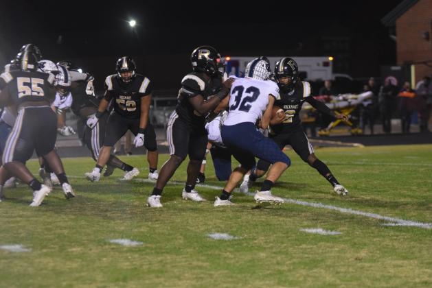 White County's Reece Dockery, No. 32, comes up to tackle Rockmart quarterback Javin Whatley during the opeing drive of the game.