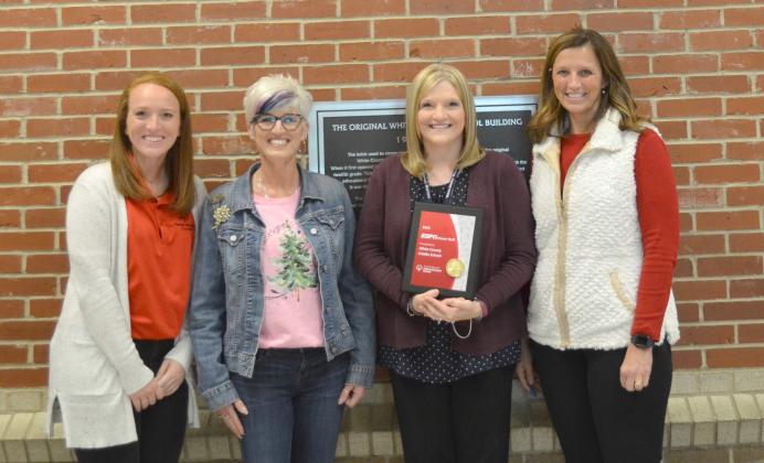 Pictured from left, are Kelli Bonner with Special Olympics Georgia, Sharon Brown with White County Special Olympics, Julie Collins and WCMS Principal Kristi Gerrells after the presentation on Thursday, Dec. 10. (Photo/Stephanie Hill)