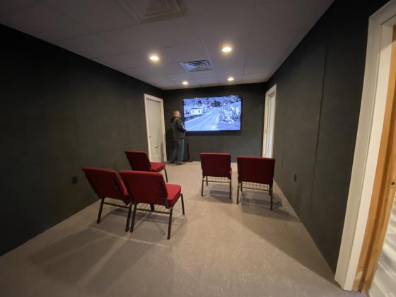 Above, David Greear watches a video he produced telling about the history of Helen. The presentation is part of a new theater room at the Helen Arts &amp; Heritage Center. (Photos/Stephanie Hill)
