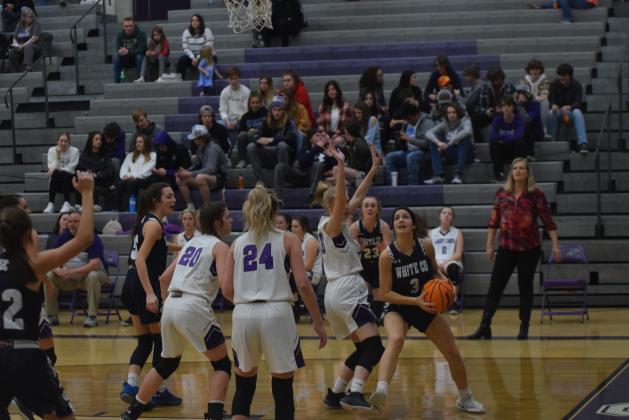 Caitlyn Gailey, right, drives along the baseline during the Lady Warriors' win at Gilmer County Tuesday night. (Photos/Mark Turner)