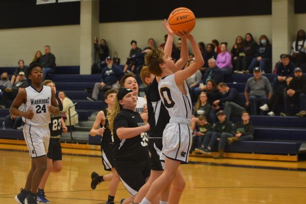 Josh Adams, above, and the seventh-grade boy's team posted a 35-19 opening round win Tuesday over Lumpkin County.  (Photo/Mark Turner)