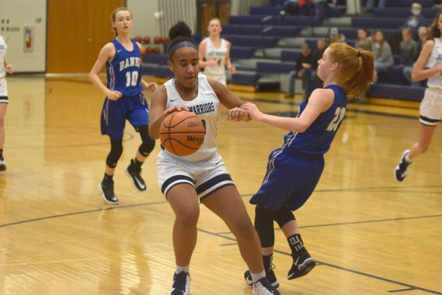 Kiannah Dorsey protects the ball during a recent eighth-grade girls game. (Photos/Mark Turner)