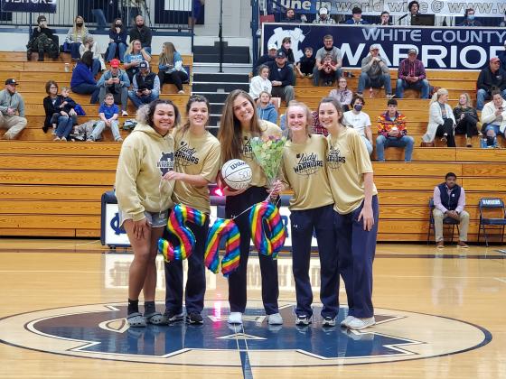 Senior Maddie Futch, with ball, was honored during a postgame ceremony after she recently passed the 500- rebound mark for her career. Futch was joined in the ceremony by her family and teammates, including fellow seniors, from left, Dasha Cannon, Makenna Moose, Madison Adams, and Camyrn McAfee.