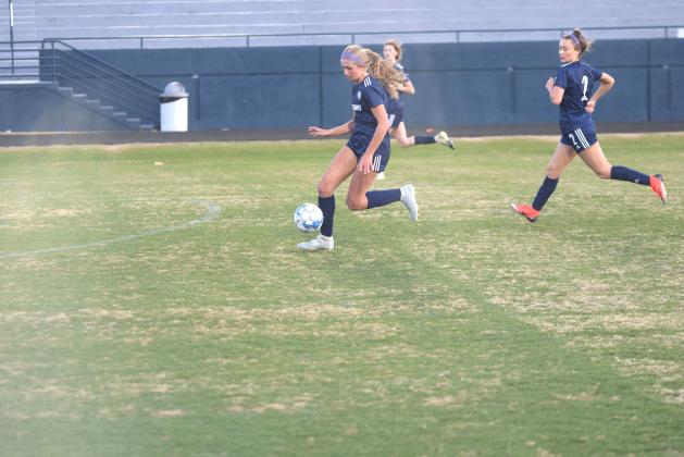 LaRue Campbell and the rest of the Lady Warriors opened the Region 7-AAA schedule Wednesday night with a trip to Gilmer County. The Lady Warriors, the No. 2 team in the latest Class AAA state poll, take on Dawson County next Tuesday in the first region home match. (Photos/Mark Turner)