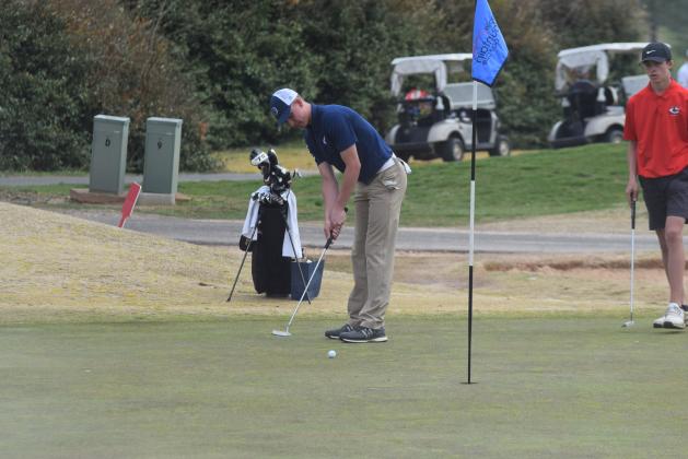 Jacob Adams rolls a putt toward the hole during the tournament last Saturday. (Photo/Mark Turner)