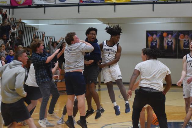 WCHS' Tavi Simmons, right, celebrates with Alex Garcia, left, and Zion McMullen moments after the Warriors knocked off Lakeview-Fort Oglethrope in the opening round of the Class AAA tournament Tuesday in Cleveland. (Photos/Mark Turner)