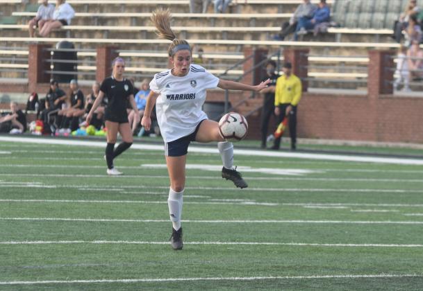 Ada Smith and the Lady Warriors dropped a 3-0 decision Tuesday to West Forsyth. (Photo/Mark Turner)