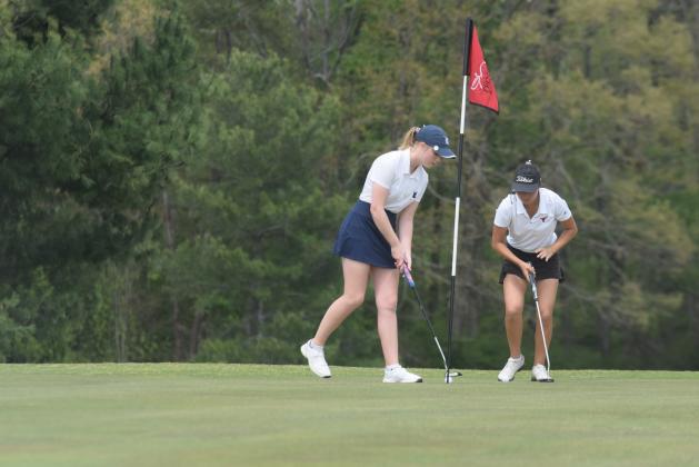 WCHS senior Catie Craig taps in a putt during the Spring Swing last Saturday in Clarkesville. (Photo/Mark Turner)