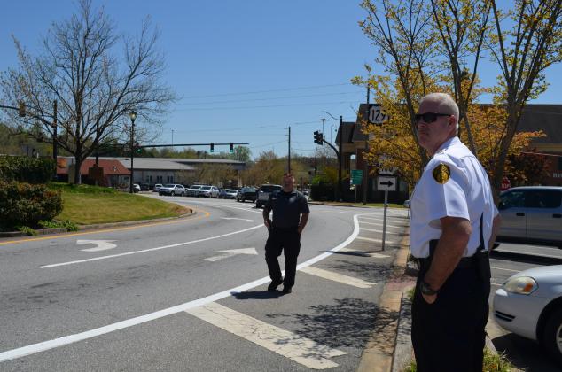 Georgia Office of Highway Safety Officer Ed Weaver (left) and CPD Chief Jeff Shoemaker monitor traffic. (Photos/Stephanie Hill)