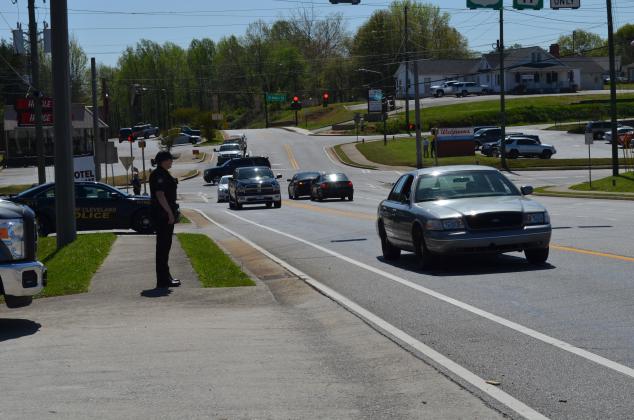 Officer Sarah Emery observes motorists at the intersection of U.S. 129 S. and Helen Highway.