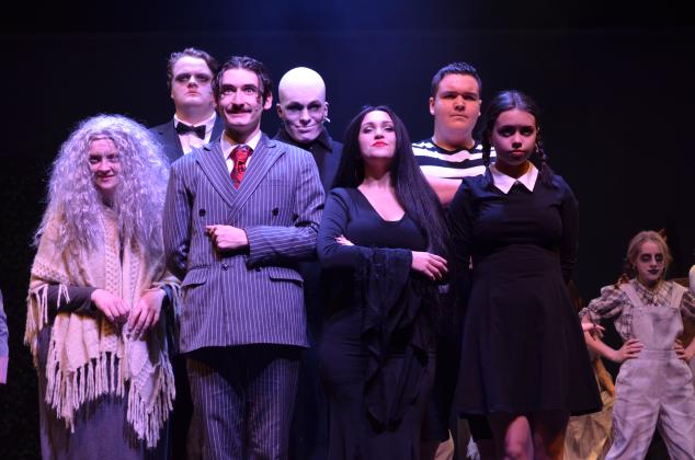 Pictured from left, are Doni Martin as Grandma, Tim Behan as Lurch, Ben Perrin as Gomez Addams, Colin Baughman as Fester, Ireland Ballington as Morticia Addams, Gabe Talafous as Pugsley, and Molly Cutchshaw as Wednesday Addams, during one of the final dress rehearsals before the show opens. (Photos/Stephanie Hill)