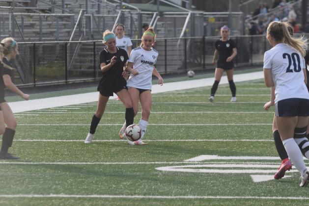 Hazen Ramey, right, set the single season scoring record Tuesday night, scoring her 25th goal of the season in the 3-0 win over North Hall. (Photo/Mark Turner)