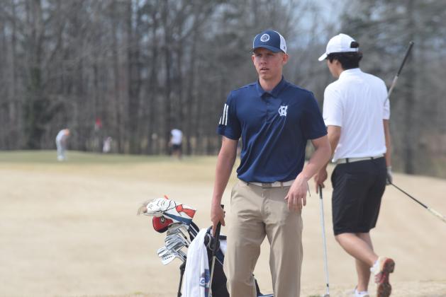 Jacob Adams, who will play the in the No. 1 spot for the Warriors in the area tournament, recently signed with Truett McConnell University. (Photo/Mark Turner)